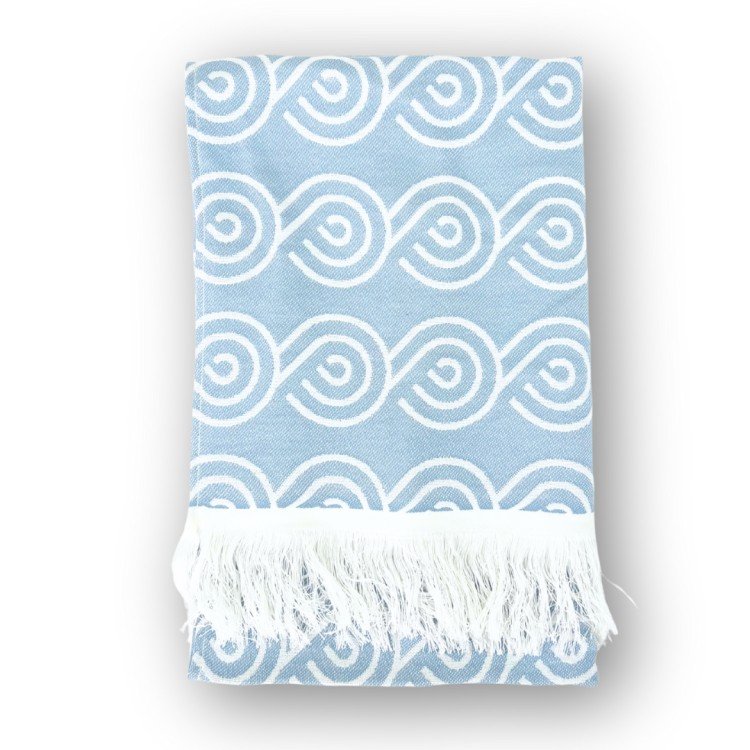 1. Blue bamboo towel with white swirl pattern and fringed edges, folded on a white background