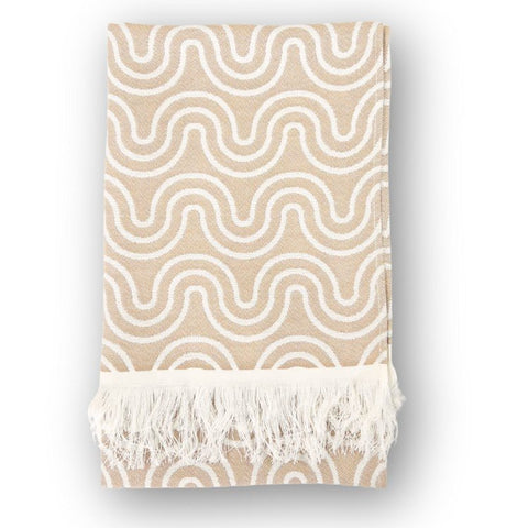 2. Beige bamboo towel with white wave pattern and fringed edges, folded on a white background