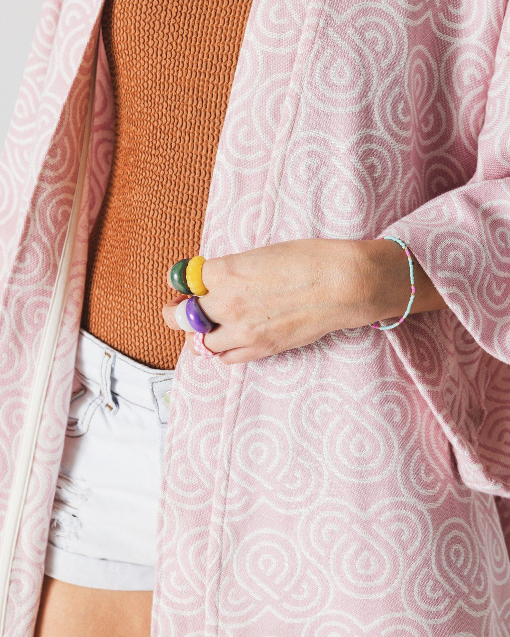 7. Close-up of Patulove rose bamboo kimono showing spiral pattern and colorful accessories