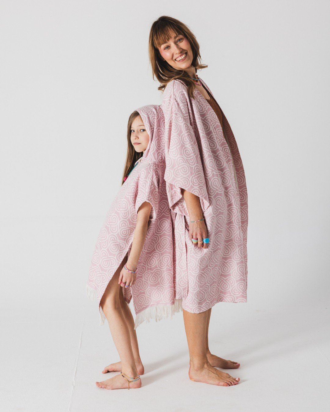6. Woman and girl smiling, wearing Patulove rose bamboo kimonos, girl in hooded version