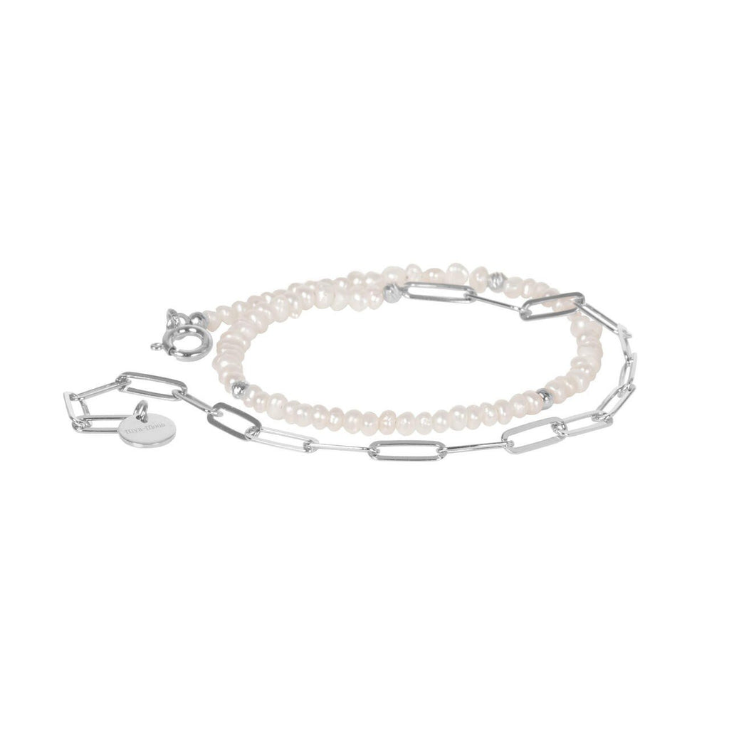 1. MyaMoon Pearlstring Bracelet-Choker in silver rhodium, featuring elegant pearls and adjustable chain, studio shot