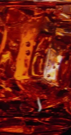 3. Close-up of amber liquid with light reflections, highlighting rich color