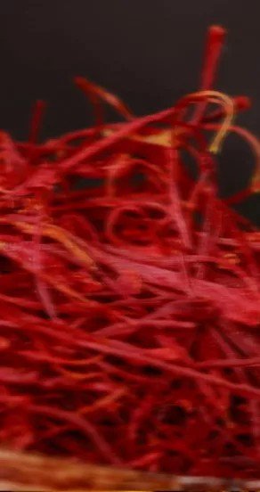 17. Close-up of red saffron threads, representing exotic fragrance elements