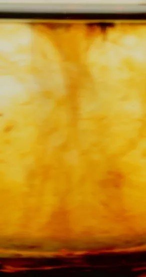 4. Abstract view of swirling golden liquid