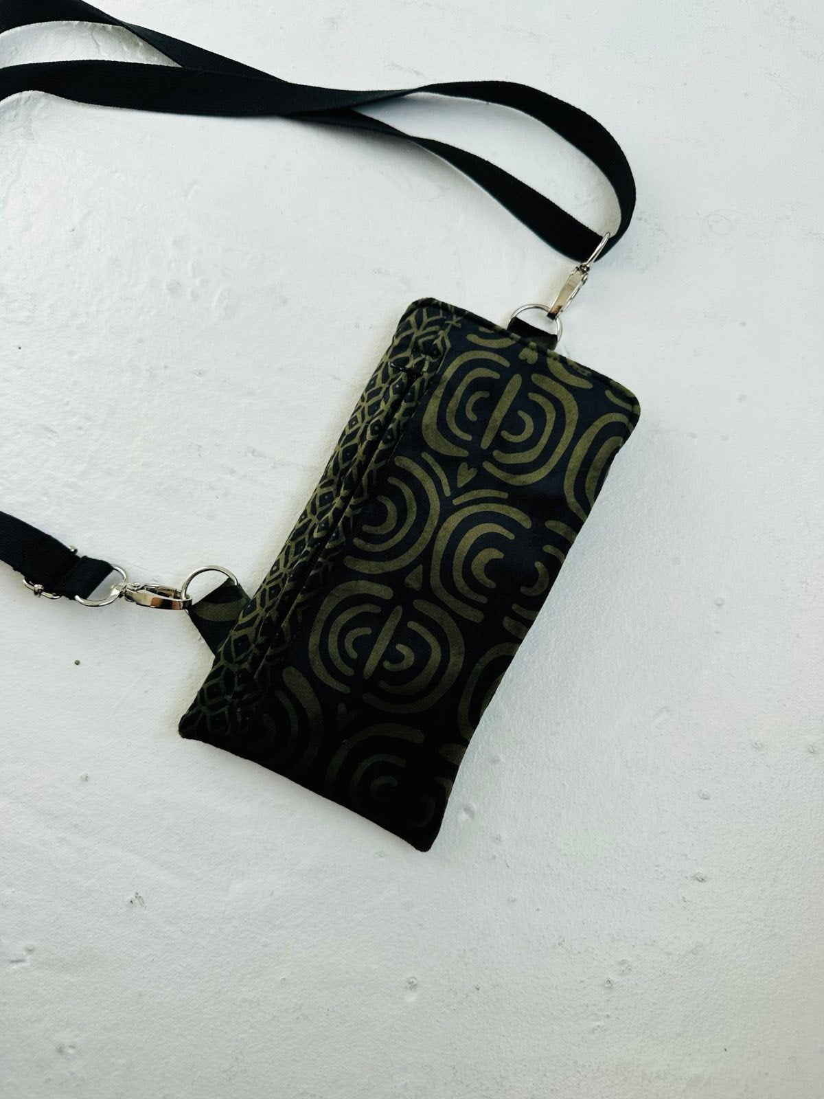 2. Studio shot of Garbanota khaki pattern velour phone bag with adjustable strap