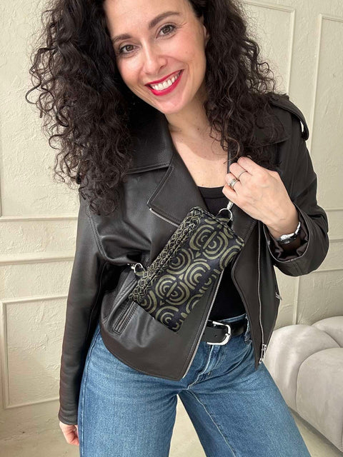 1. Woman wearing Garbanota khaki pattern velour phone bag crossbody, styled with leather jacket