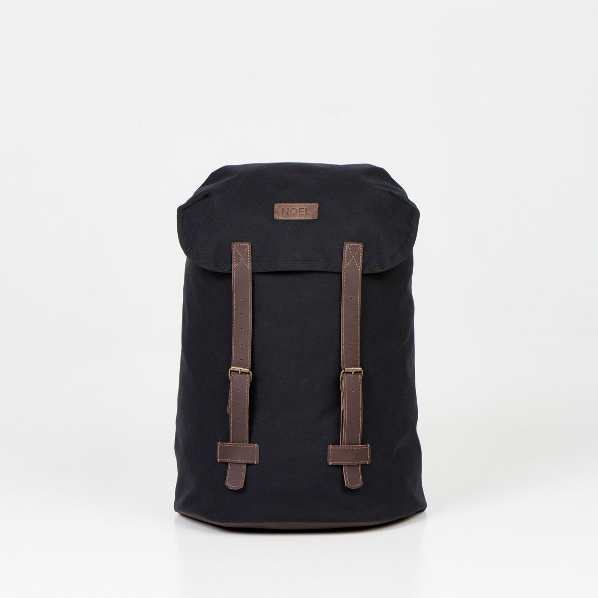 1. Noel Cafe Handmade Backpack in black Cordura, front view with brown straps, studio setting