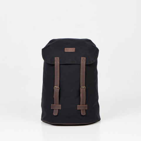 1. Noel Cafe Handmade Backpack in black Cordura, front view with brown straps, studio setting