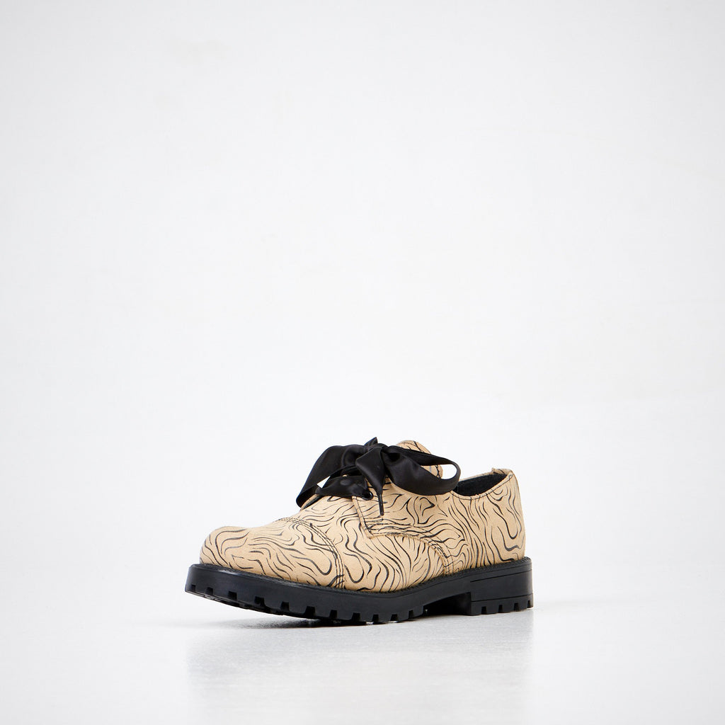 3. Unisex Samelin Beige Zebra Widgets in beige with zebra pattern, front angle in studio