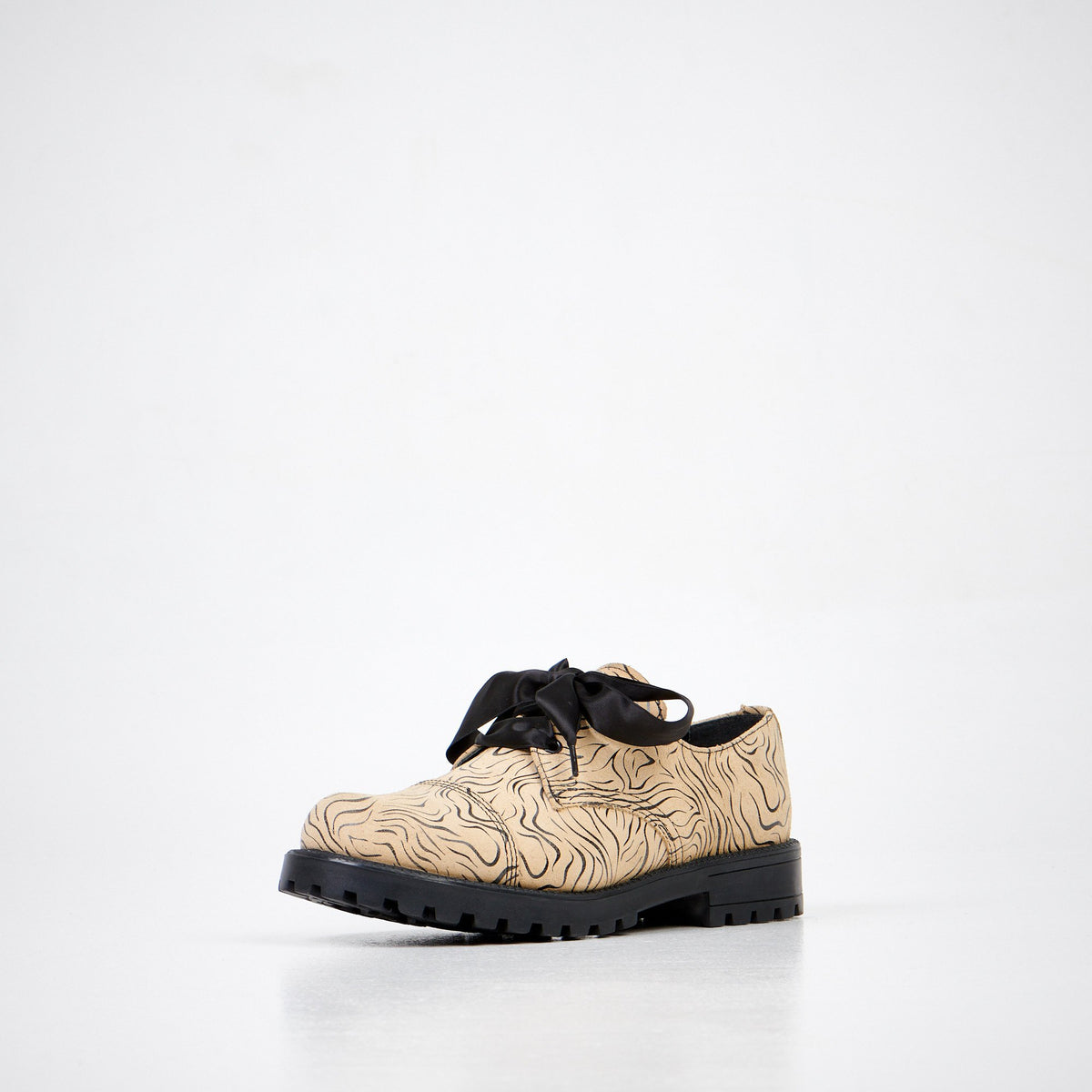 3. Unisex Samelin Beige Zebra Widgets in beige with zebra pattern, front angle in studio