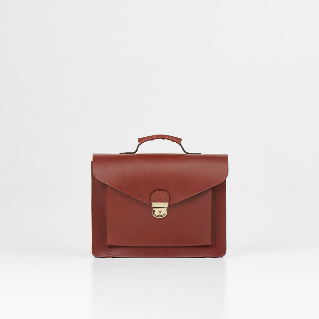 2. Front view of Papillon Briefcase No. 36 in cognac leather, studio setting