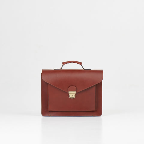 2. Front view of Papillon Briefcase No. 36 in cognac leather, studio setting