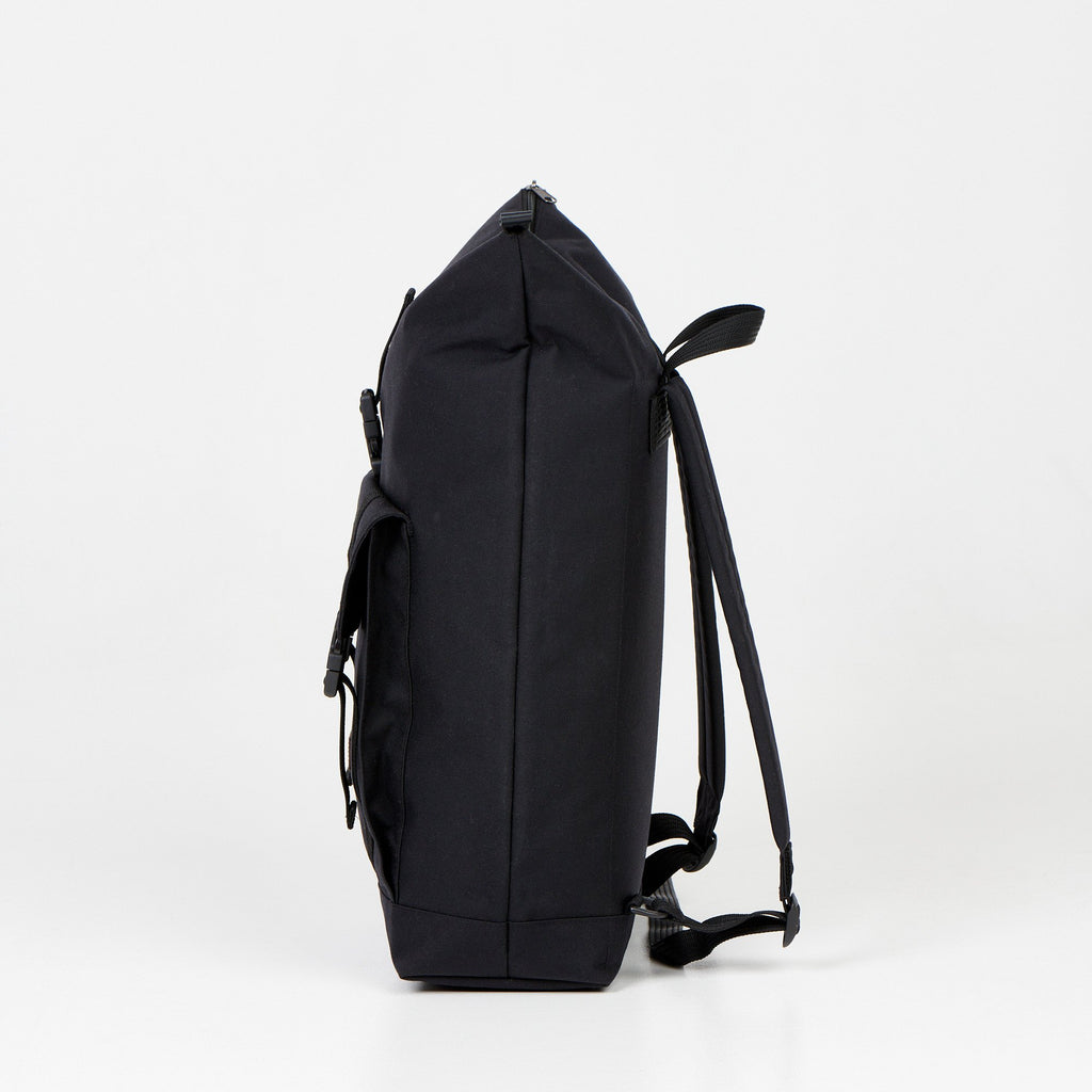 6. Side profile of Noel Cliff 25L black backpack showing depth and strap design