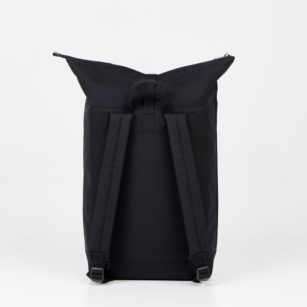 2. Back view of Noel Cliff 25L black backpack showing adjustable straps, studio setting