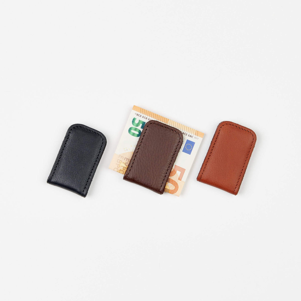 2. Trio of Papillon magnetic money clips in black, brown, and cognac leather with euro notes