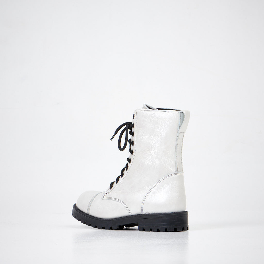 2. Women's 511 Bianco boots in white leather, angled side view showing black laces and rugged sole