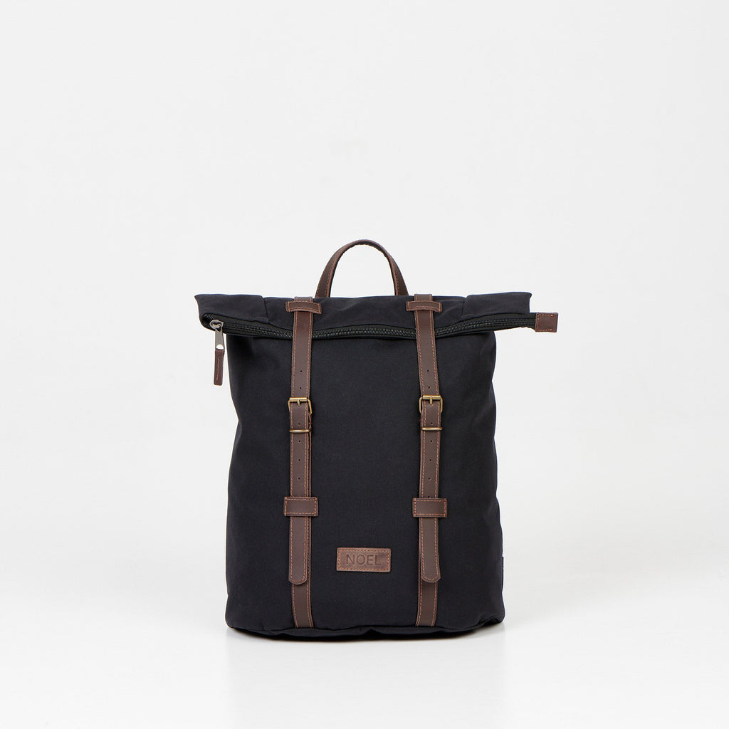 2. Noel black zip backpack with leather straps, front view slightly angled in studio