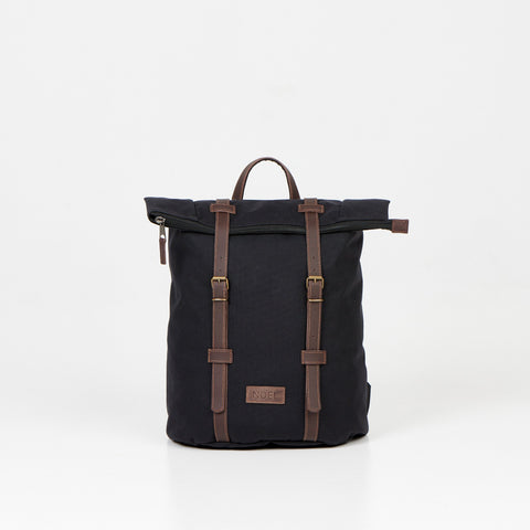 1. Noel black zip backpack with leather straps, front view in studio setting