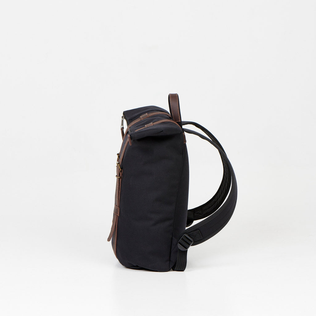 3. Side view of Noel black zip backpack showing adjustable shoulder straps