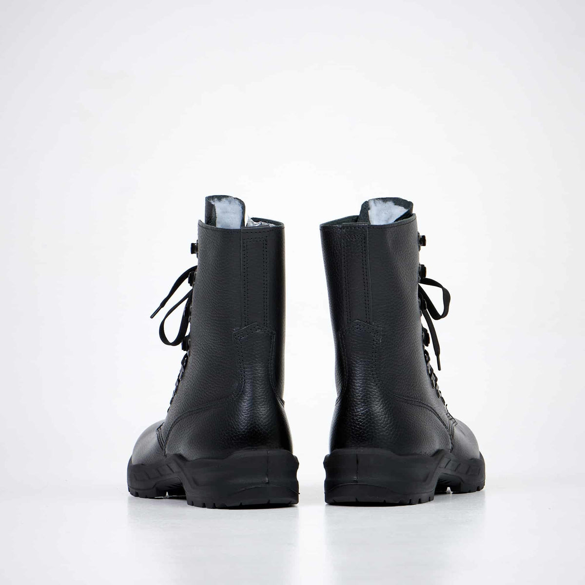 1. Back view of Samelin 2077 Combat Boots in black leather, showcasing dual-layer sole and high-top design