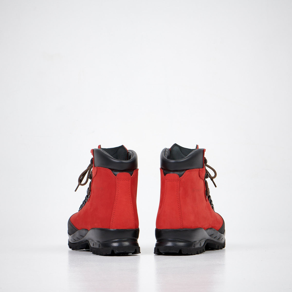 1. Back view of Samelin 553P Rosso Hiking Boots in red nubuck leather with black Vibram sole, studio setting