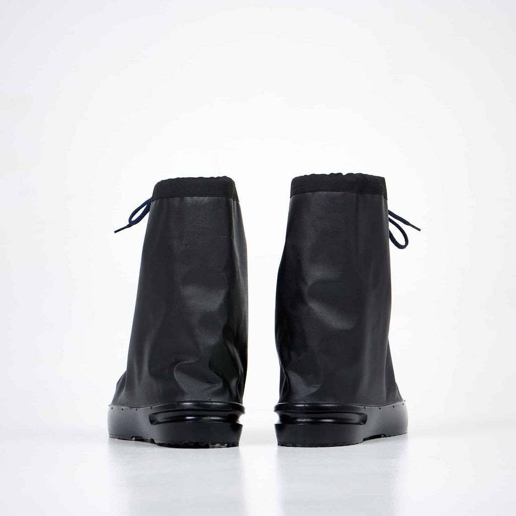 8. Back view of Samelin overboots in studio, displaying compact and foldable features