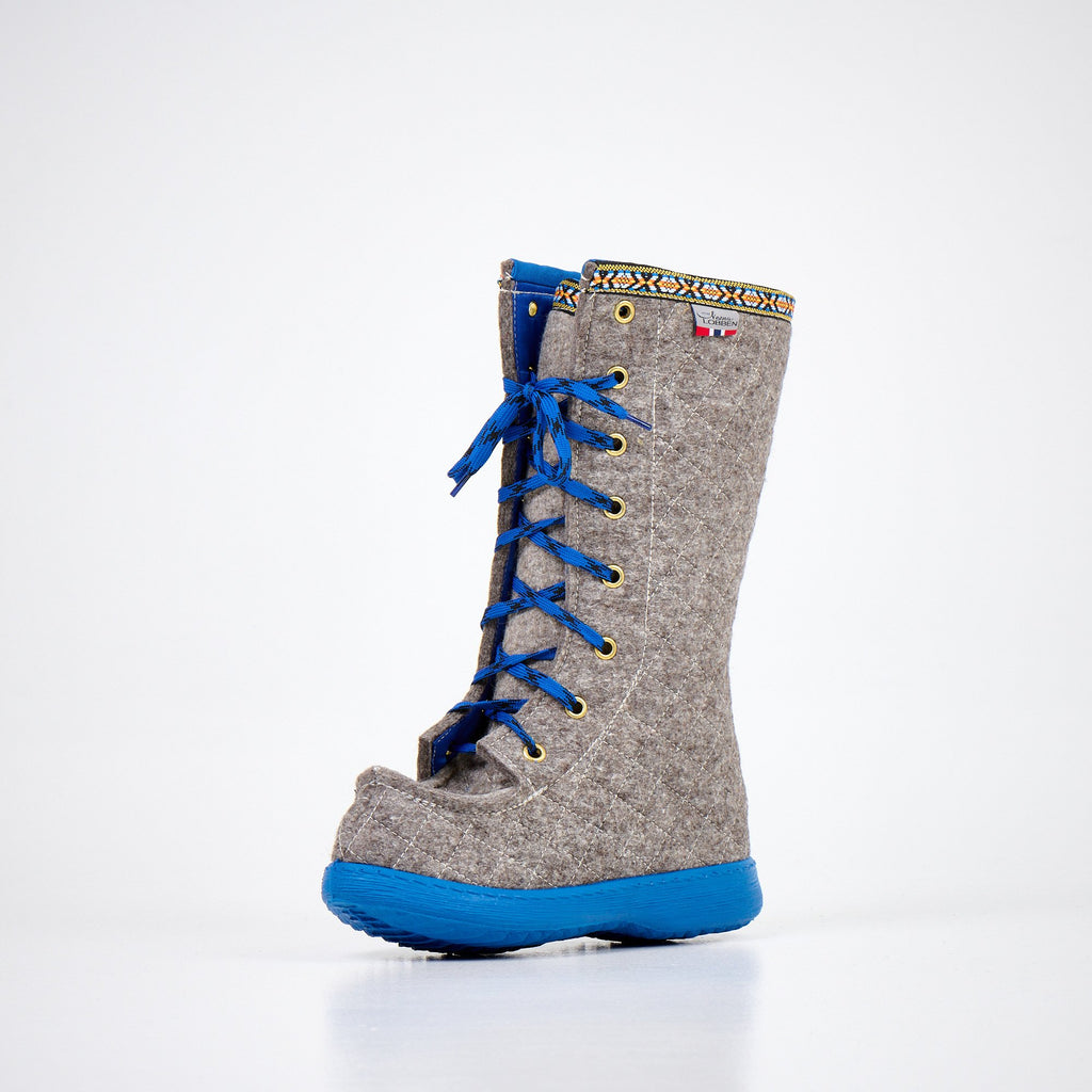 1. Nesna Lobben Polar Lobben Felt Boots in grey with blue laces and soles, shown in studio setting