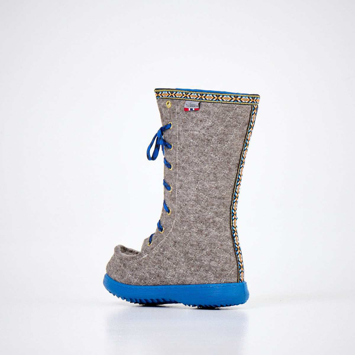4. Alternate side view of Nesna Lobben Polar Lobben Felt Boots in grey with blue laces and soles, studio setting