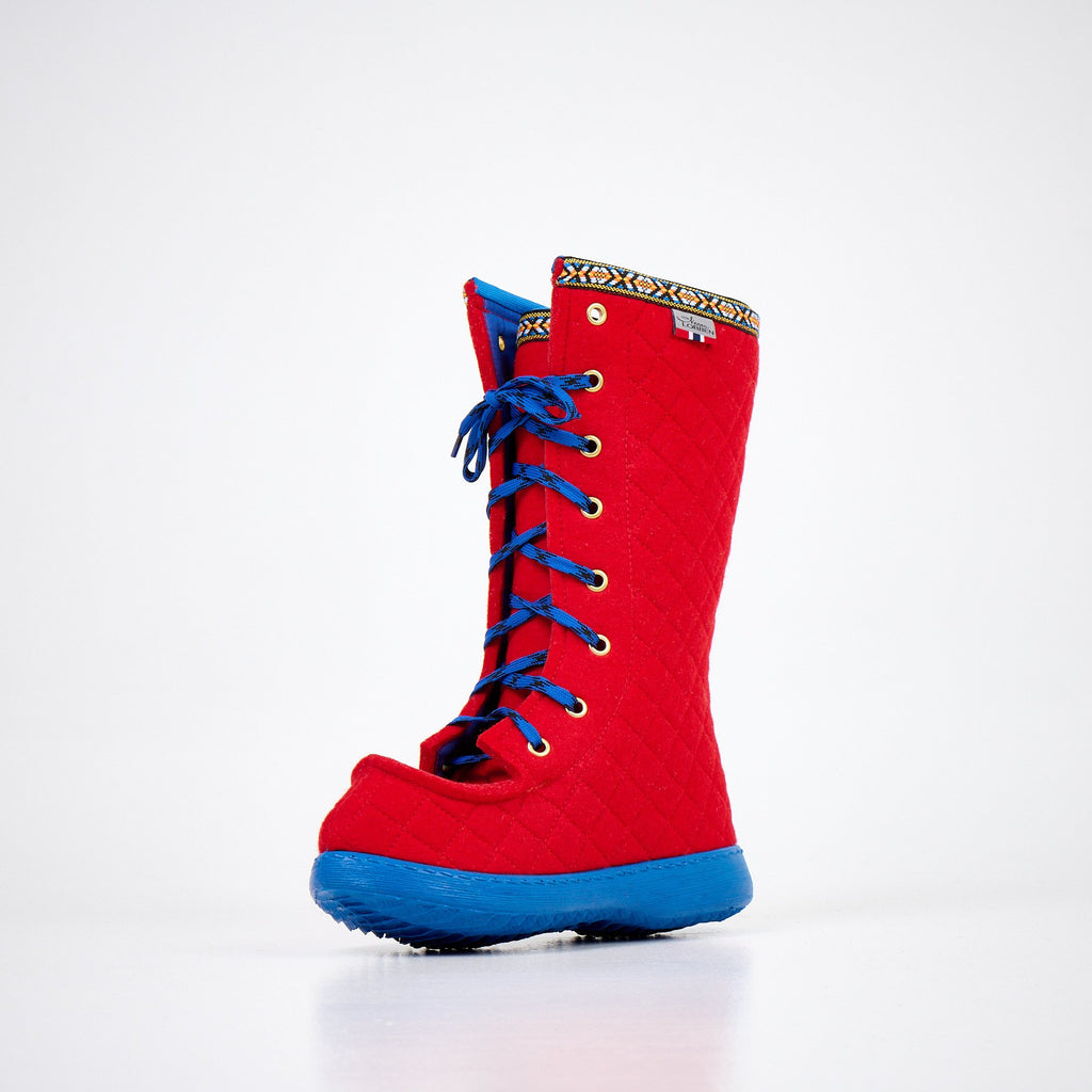 3. Front angled view of Nesna Lobben Polar Lobben Felt Boots in red with blue laces, emphasizing non-slip soles