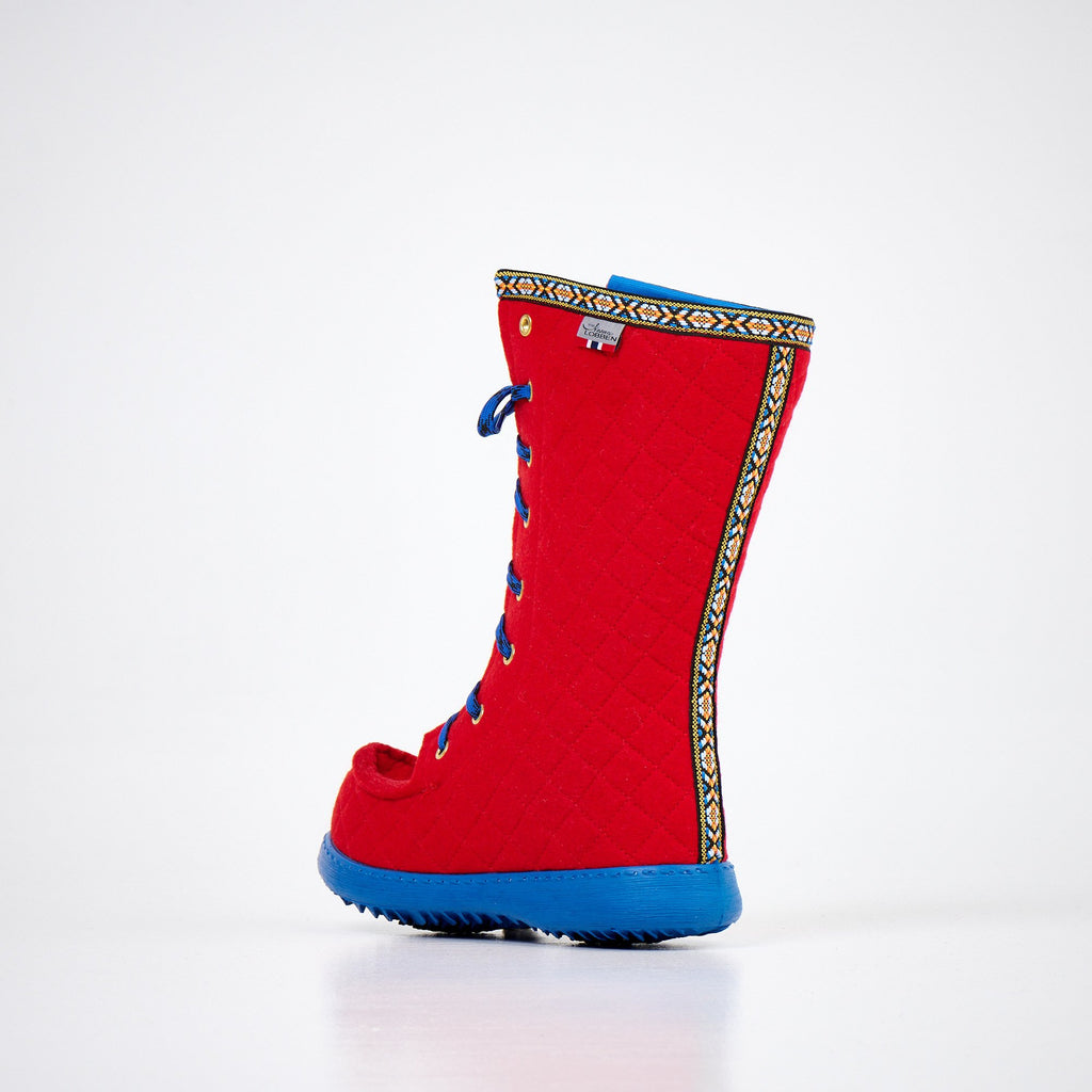2. Side view of Nesna Lobben Polar Lobben Felt Boots in red with blue laces and soles, highlighting wool felt material