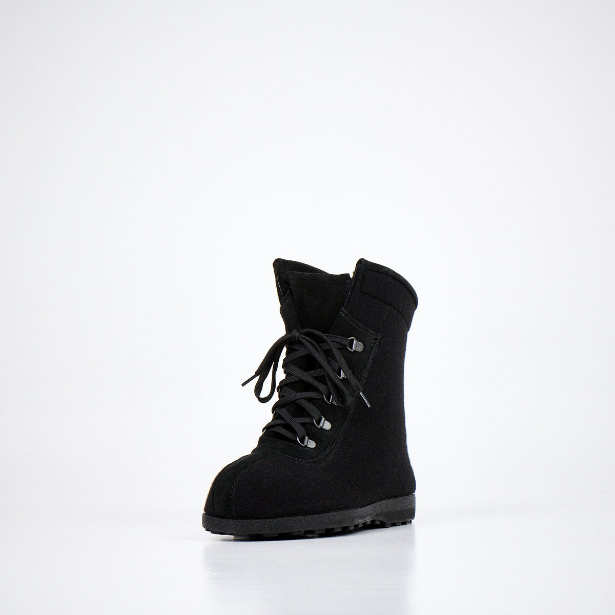 5. Front view of Nesna Lobben black felt boots, featuring lace-up closure and durable sole