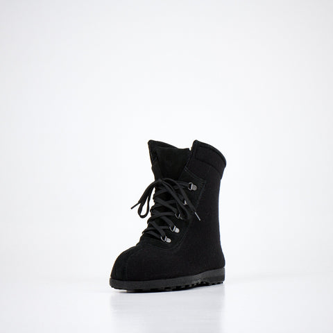 5. Front view of Nesna Lobben black felt boots, featuring lace-up closure and durable sole
