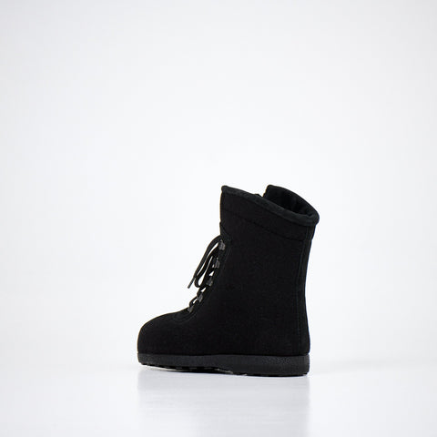 4. Side view of Nesna Lobben black felt boots, emphasizing lightweight design and wool felt construction