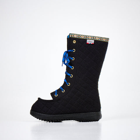2. Side view of Nesna Lobben Polar Lobben Felt Boots in black with blue laces, studio setting