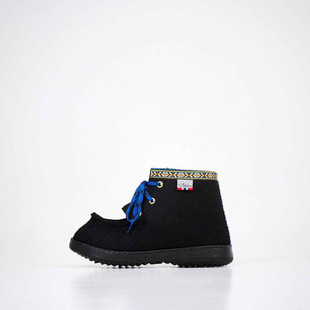 4. Side view of Nesna Lobben black felt boots with blue laces and patterned trim, highlighting polyurethane sole and wool material
