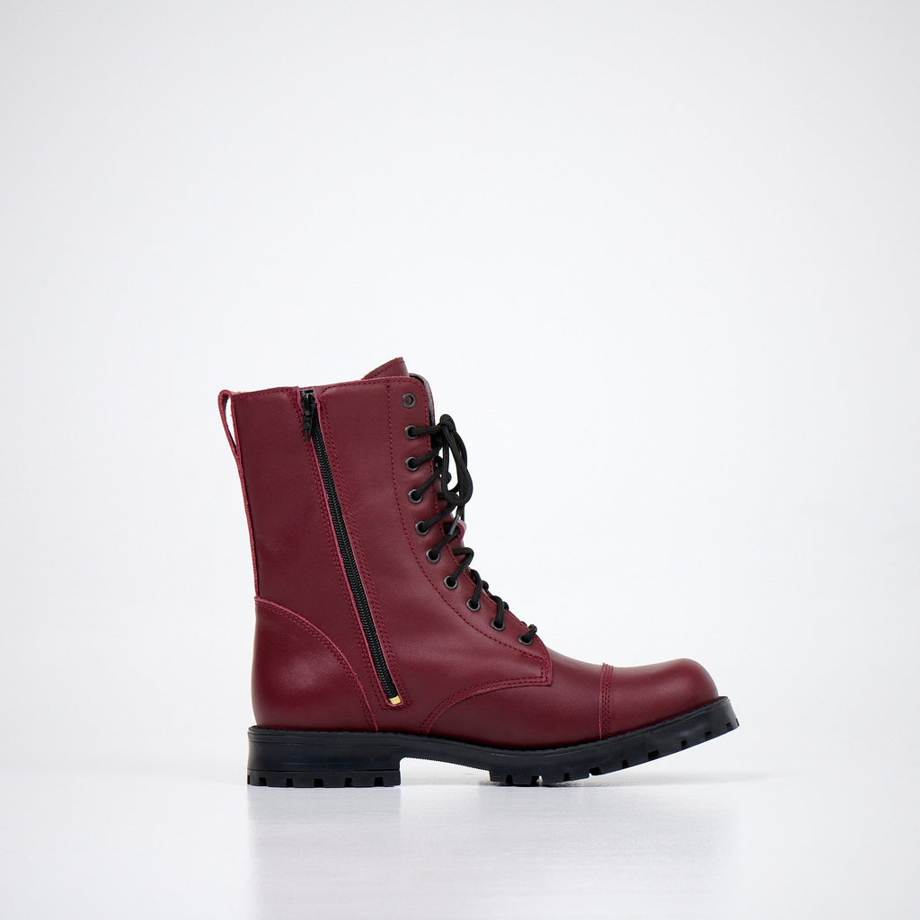 6. Unisex red Samelin 511 Granny Smith boots with zipper, side view in studio setting