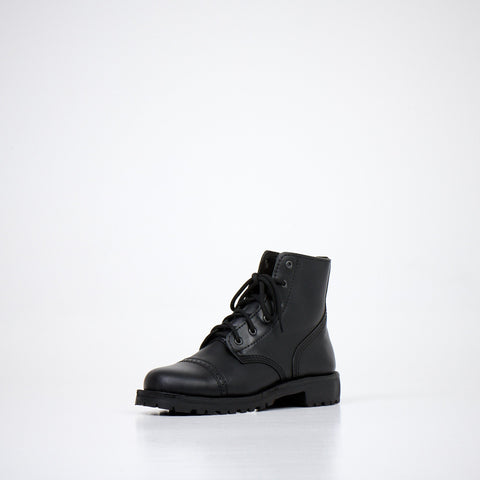 5. Angled view of AIPI A-PS-2 black leather boots, highlighting military-inspired design and traction sole in studio