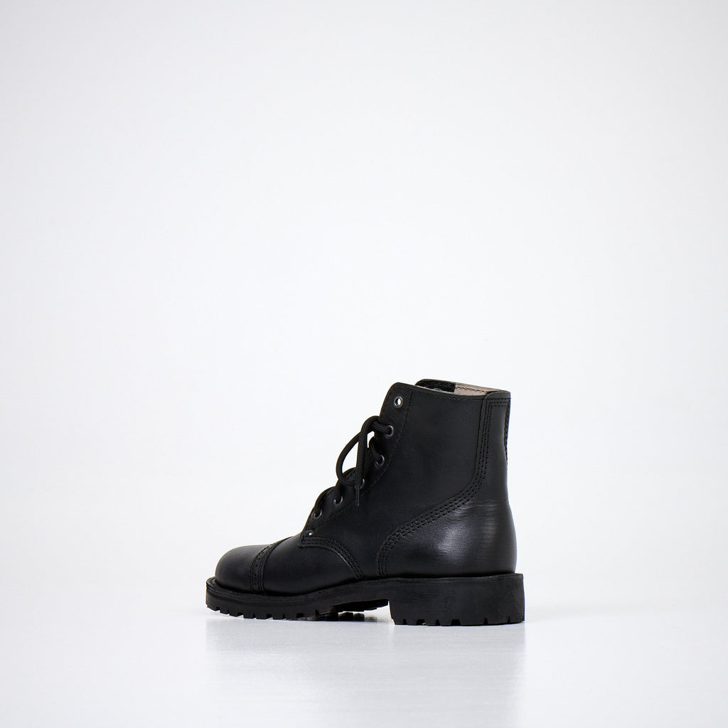 2. Side view of AIPI A-PS-2 black leather boots with lace-up design, highlighting rugged style and robust sole in studio