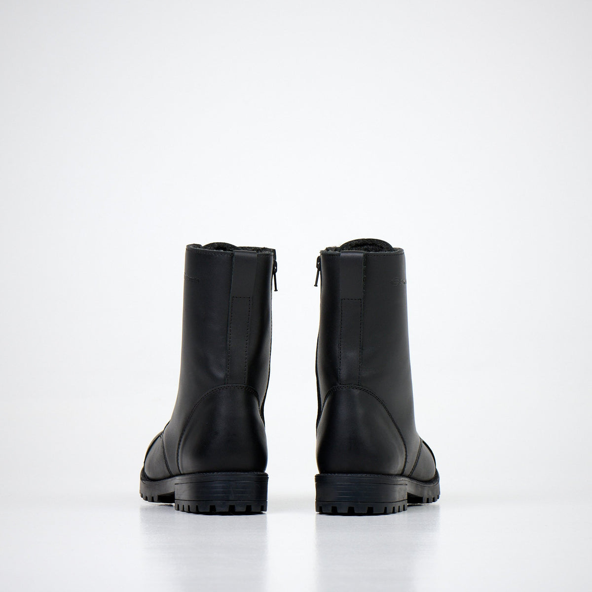 7. Back view of unisex black Samelin 511 Winter With Zipper 2.0 boots in studio, highlighting sleek leather and zipper detail