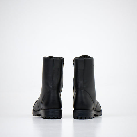 4. Back view of unisex black leather boots with zippers on white background