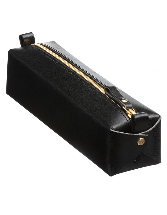 3. Black leather pencil case by Stella Soomlais with gold zipper detail, shown in studio lighting to emphasize craftsmanship and material quality