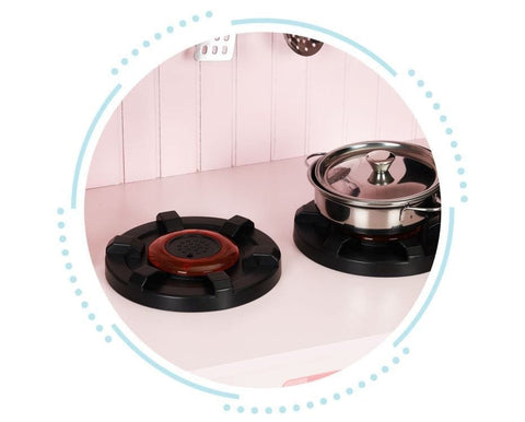 3. Close-up of two black burners on pink play kitchen with a metal pot on one burner