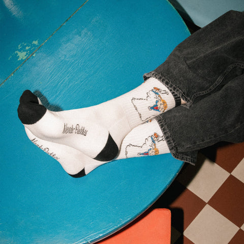1. Men's Pippi Longstocking retro socks by NordicBuddies in lifestyle setting, featuring playful design on white cotton blend