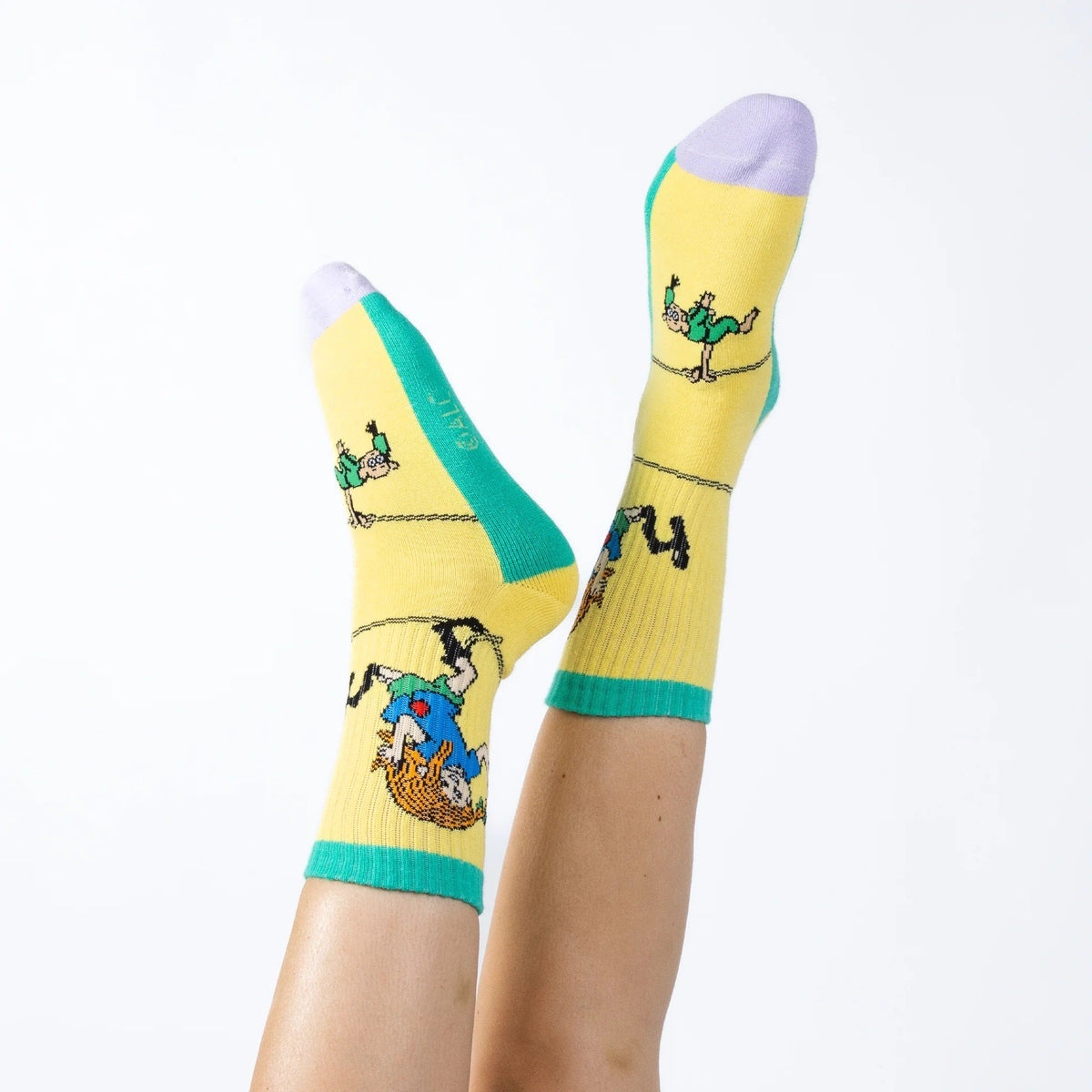 1. Women's Pippi Longstocking yellow panel socks by NordicBuddies, worn by model, showcasing playful design