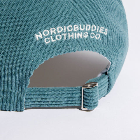 4. Close-up of adjustable strap and NordicBuddies branding on Pippi Corduroy Dad Cap in petrol