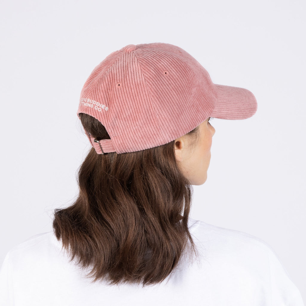 3. Back view of woman wearing pink Pippi Corduroy Dad Cap by Moomin, showing adjustable strap