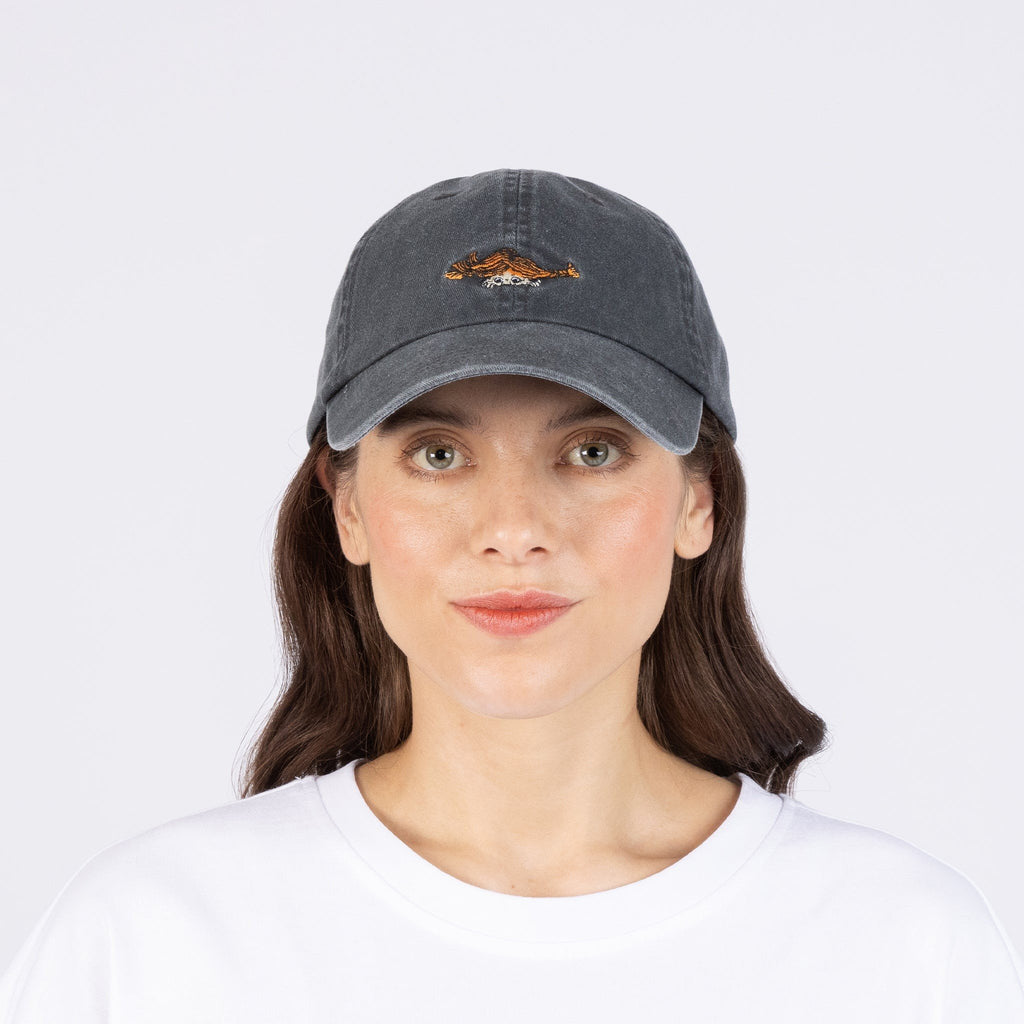 1. Women's Pippi Denim Dad Cap in black by Moomin, worn by model in studio setting