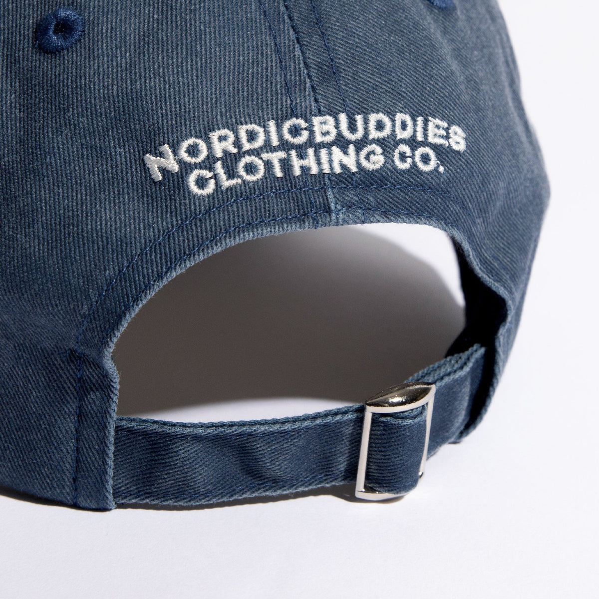 2. Close-up of adjustable strap on Pippi Denim Dad Cap with NordicBuddies branding