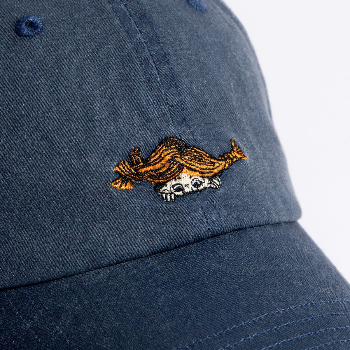 3. Close-up of Pippi Longstocking embroidery on blue denim cap by Moomin