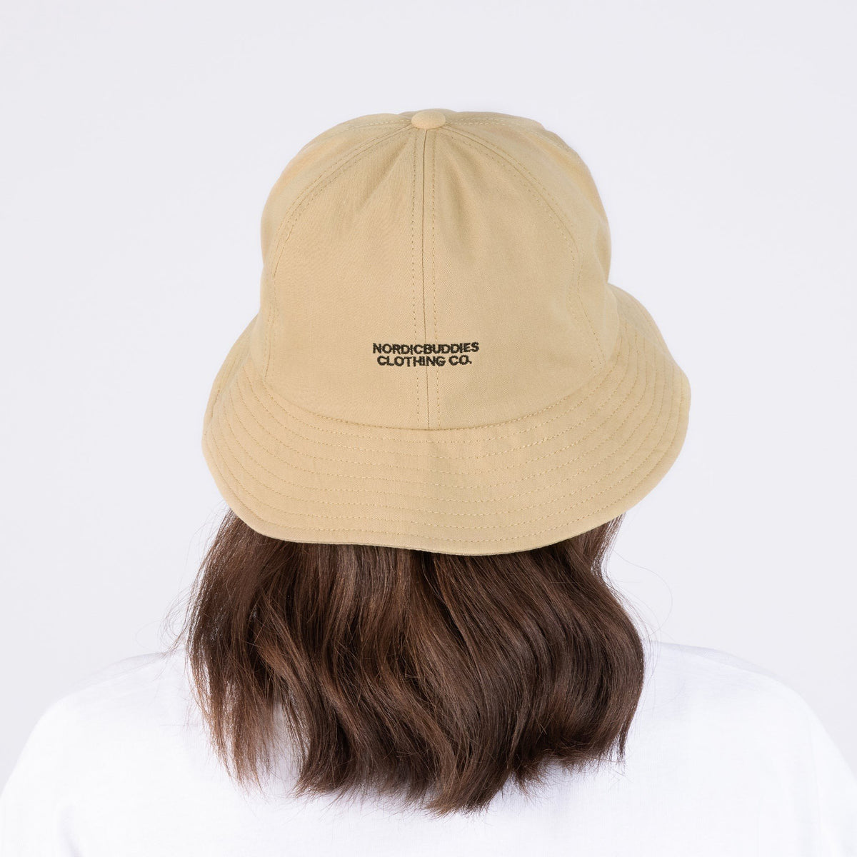 4. Woman wearing Pippi Longstocking beige bucket hat by NordicBuddies, shown from the back